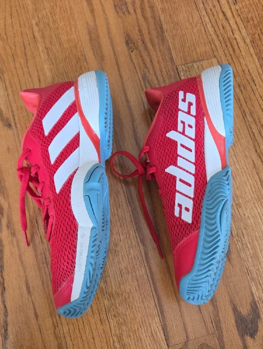 Red ADIDAS Tennis Shoes with Blue Soles